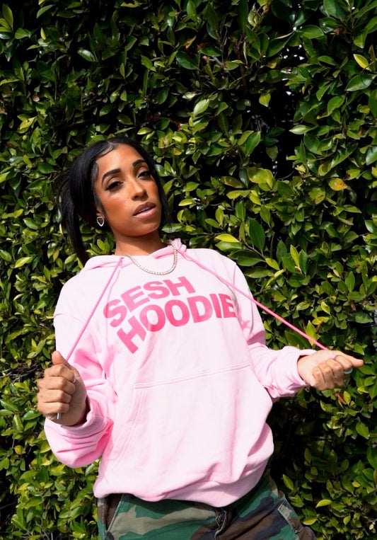 Pink SESH hoodie worn outdoors